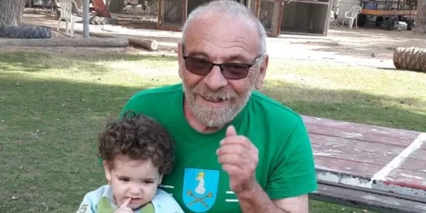 Alex Danzig with one of his granddaughters, Aviv, at the time aged two