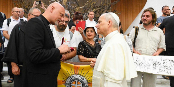 Fr. Piotr Zelazko speaks with Pope Leo at the Wednesday General Audience